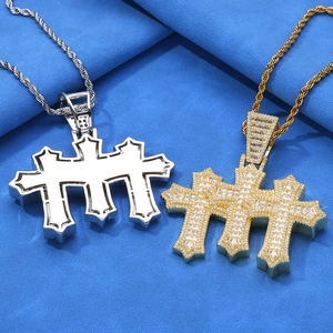 Close-up of hip hop triple cross pendants with iced out square cut moissanite stones