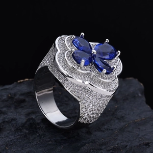 Men's hip-hop wide ring featuring blue floral zircon stones on black rock base