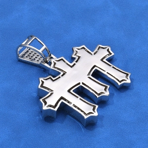 Hip hop silver layered cross pendant with iced out bail on blue background