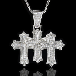 Macro shot of silver hip hop cross pendant with baguette zircons and rope chain detail