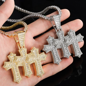Hip-hop cross pendant set in gold and silver with shimmering baguette zircon stones