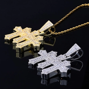 Close-up of hip hop cross pendants with square zircon inlay in gold and silver finish