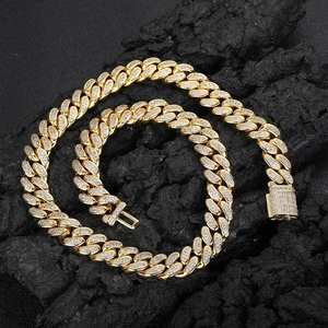12mm gold Cuban link chain with double row full zircon inlay on black volcanic rock