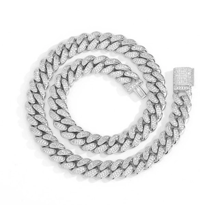 Detailed macro view of 12mm silver iced out Cuban chain with pave cubic zirconia stones