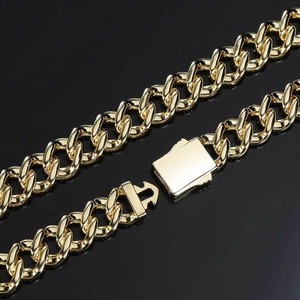 Macro shot of 12mm gold cuban link chain with a micro-paved zircon box clasp buckle