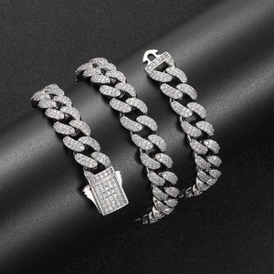 Detail of 12mm silver Cuban link chain with micro-paved cubic zirconia and spring clasp
