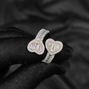 Exquisite Toi et Moi heart ring with baguette cut stones and micro-pave detailing
