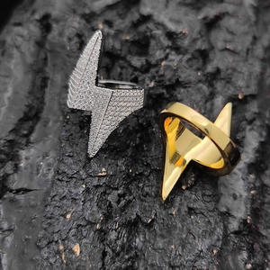 Hip hop lightning bolt rings in gold and silver finish with pave zircons on dark rock