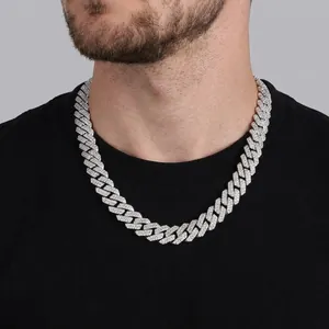 Silver cuban chain necklace with white zircons on male model wearing black t-shirt