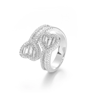 Macro shot of silver dual-heart ring with mixed square and round cubic zirconia stones