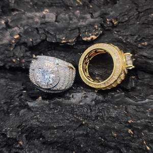 Macro view of gold and silver hip hop rings with micro-paved oversized zircon stones