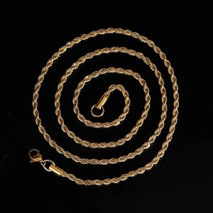 Detail of 18K gold-plated stainless steel rope chain with a lobster clasp on black background