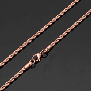Detail of 18K rose gold rope chain necklace showing its twisted texture and lobster clasp