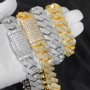 Detailed close-up of thick iced-out Cuban chains with rectangular T-shaped zircons