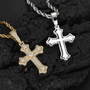 Hip hop iced out cross pendants in gold with zircons and polished silver on black rock