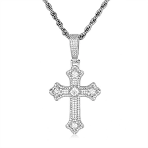 Detailed macro view of iced-out silver cross pendant with sparkling cubic zirconia stones