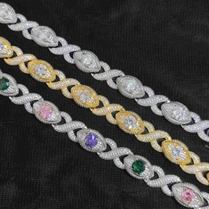 Detailed close-up of 15mm iced-out Cuban link bracelets in silver, gold and colorful stones
