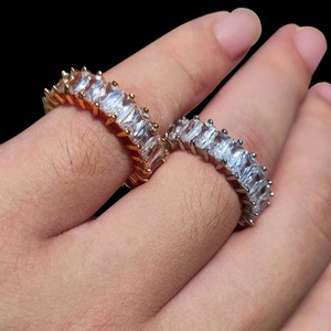 Macro shot of gold and silver plated hiphop rings with rectangle cut cz stones