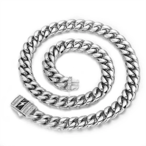 Macro shot of stainless steel Cuban link chain featuring a lightning bolt zircon buckle
