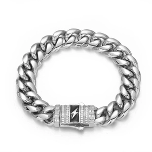 Macro detail of silver stainless steel Cuban chain bracelet with lightning bolt zircon clasp