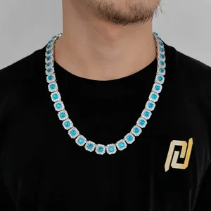 Detail of 12mm tennis chain necklace with blue zircon stones on male model wearing black tee