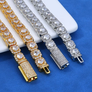 Macro detail of luxury 7mm hip hop chains with shimmering cubic zirconia in gold and silver