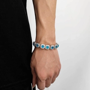 Luxurious silver-tone hip hop bracelet featuring large square blue stones and zircons