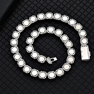 Detailed close-up of octagonal chain links and fold-over clasp with small zircon accents