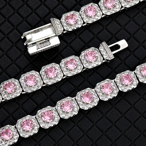 Iced out silver link bracelet with large pink cubic zirconia stones and pave diamonds