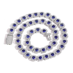 Detailed macro of 12mm iced out chain with deep blue round stones and silver pave buckle
