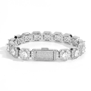Close-up of iced out silver bracelet with octagonal links and pear-cut crystal settings