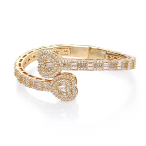 Luxurious gold double heart bangle set with cubic zirconia stones on white background