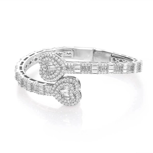 Sparkling silver heart bypass bracelet with baguette and round cut pavé crystals
