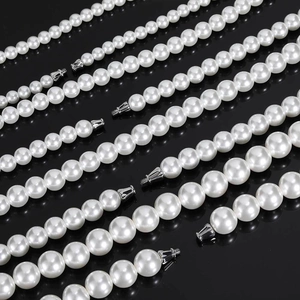Elegant white pearl necklaces in 8 sizes with silver screw clasps on black background
