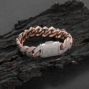 Macro detail of 18mm Cuban link bracelet with three-row zircon pavé and box clasp