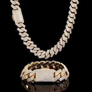 Macro shot of gold plated triple-row zircon diamond encrusted cuban chain link necklace