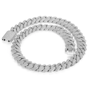 Detailed macro view of 18mm silver Cuban link chain with three rows of white cubic zirconia