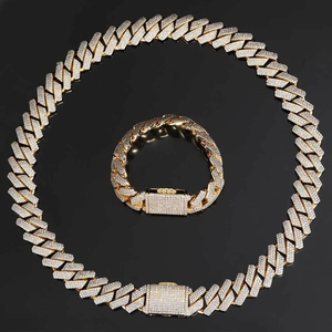 Luxurious gold-tone 18mm Cuban link necklace and bracelet set with triple-row zircons