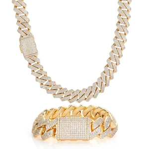 Macro view of gold-plated Cuban link set with pavé-set cubic zirconia rhinestones