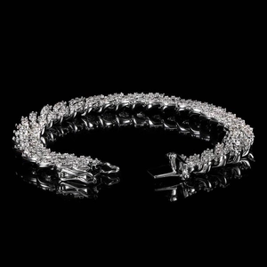 Close-up of 9mm iced out Cuban link bracelet with sparkling cubic zirconia on black background