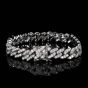 Iced out 9mm Cuban link chain with silver stones and secure clasp on black background