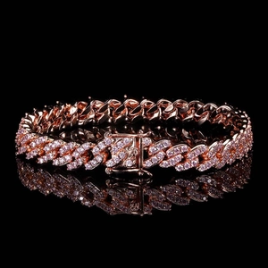 Detail shot of 9mm rose gold Cuban link bracelet with purple zircons and box clasp