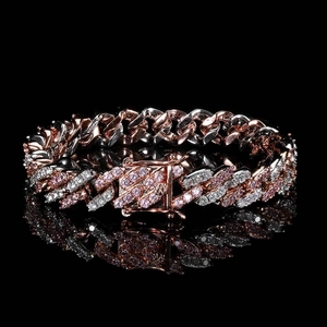 Detail of rose gold Cuban link bracelet with pink and white pavé-set zircons and clasp