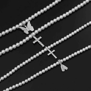 Hip hop pearl necklace with cross butterfly and letter A pendants on black background