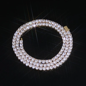 Three-row gold tennis necklace featuring brilliant round-cut cubic zirconia crystals