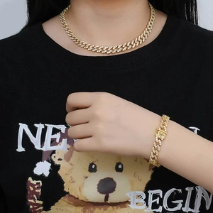 Ensemble collier et bracelet maille cubaine 9mm plaqué or avec zircons incrustés