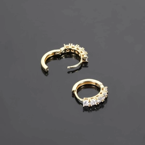 Iced out hip hop gold huggie hoop earrings with five sparkling micro-pave zircons