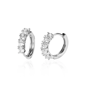 Macro shot of silver hip-hop hoop earrings with five round-cut sparkling cubic zirconia