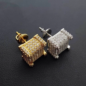 Detail of square micro-pave hip-hop studs with screw backs in gold and silver finish