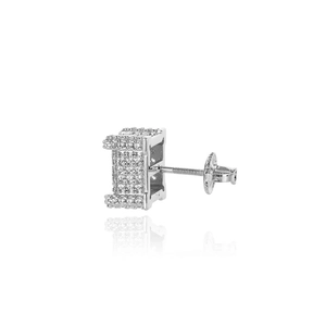 Macro shot of silver hip hop square stud earring with pave micro cubic zirconia